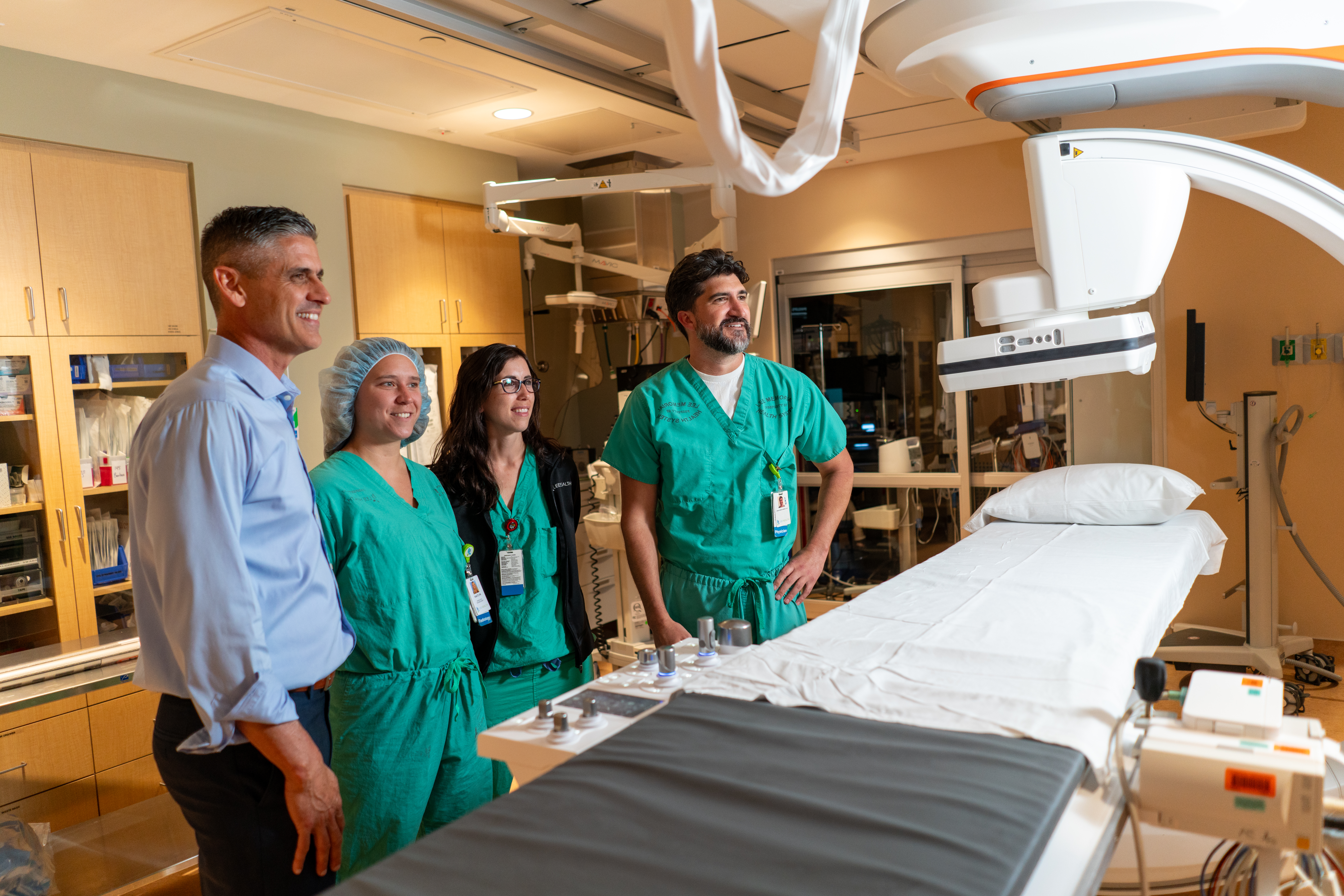 Workers looking at clinical equipment