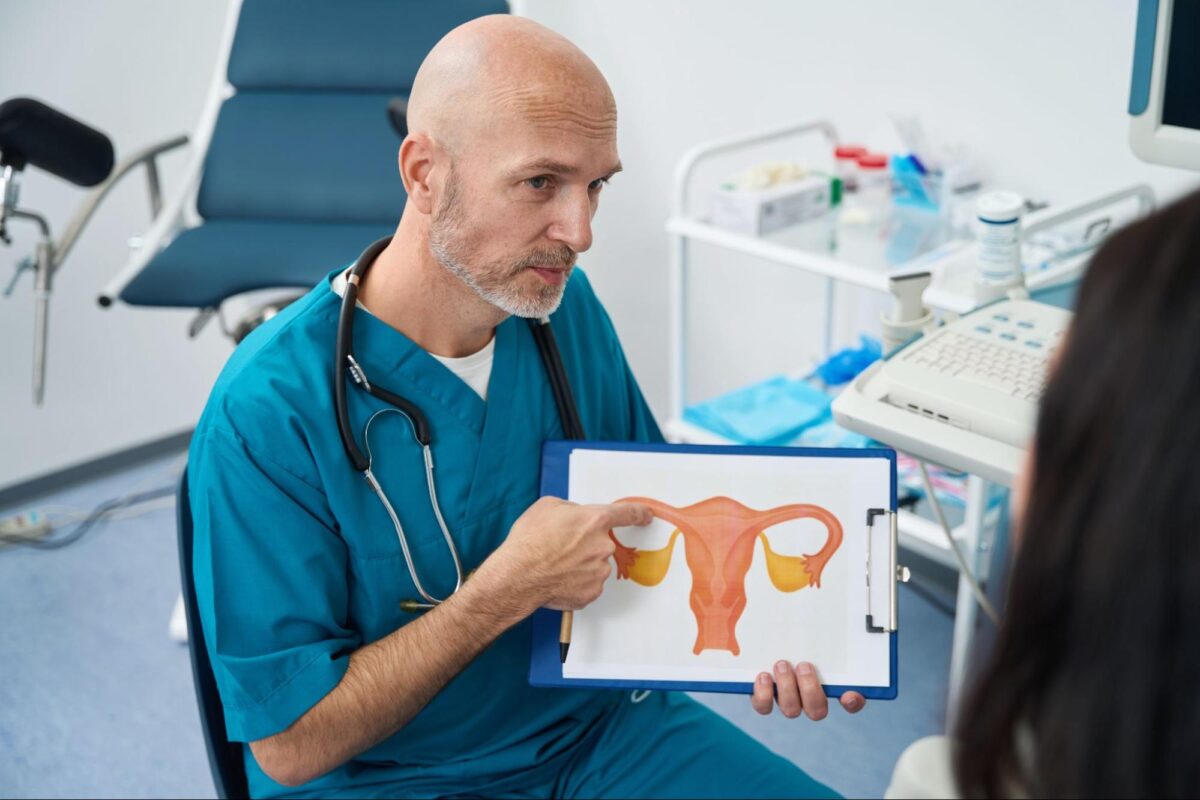 Doctor showing cervix diagram during January: cervical cancer awareness month