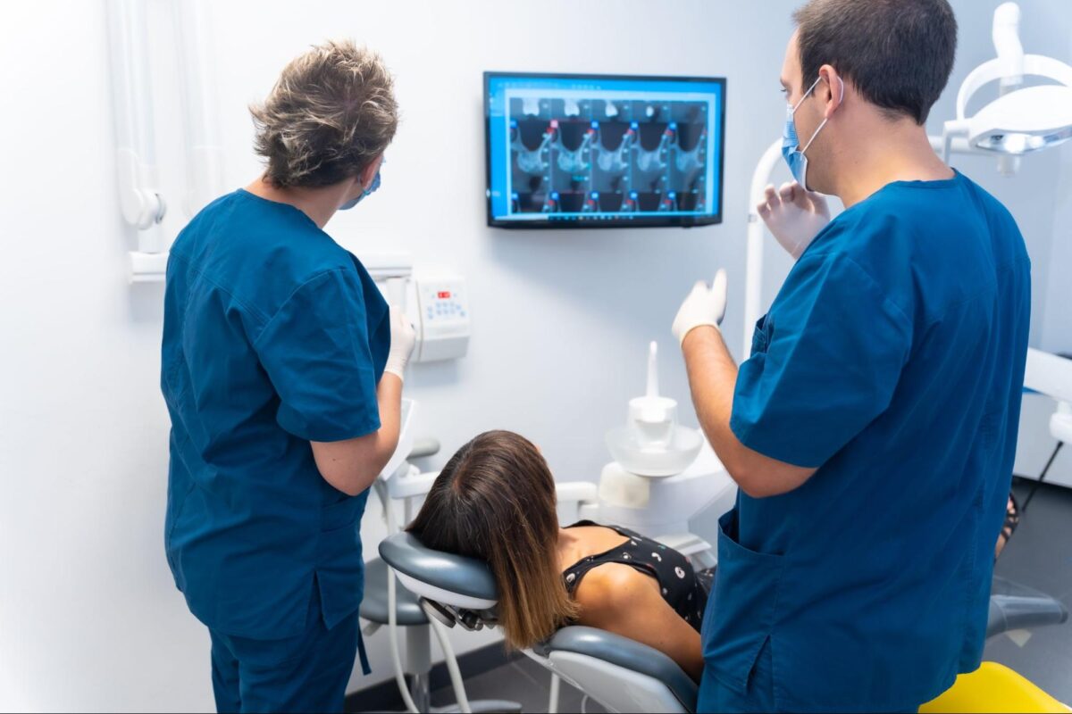 woman viewing cervical medical imaging results with doctors for cervical cancer awareness