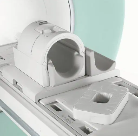 Siemens MRI head coil positioned on a scanner table ready for patient imaging
